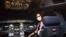 La presidenta de la Comunidad de Madrid, Isabel Díaz Ayuso, posa este lunes en una cabina durante la presentación del avión de la compañía Iberia con la imagen de la Comunidad de Madrid, 