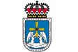 Escudo de la ciudad de Oviedo donde se muestran los seis títulos que tiene la ciudad.
