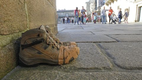 Some abandoned pilgrim boots in the plaza del Obradoiro.