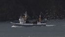 Un arrastrero de Celeiro entrando en puerto, seguido por una bandada de gaviotas, en una imagen de archivo
