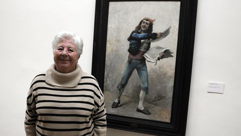 Paquita Rico junto al cuadro Vendedor de peridicos de Jos Jimnez Aranda, que perteneci a su abuelo Pedro Rico, alcalde de Madrid antes de la Guerra Civil. La obra fue incautada en 1938 y est en el Museo de Bellas Artes de Asturias hasta que sea devuelto a la familia.