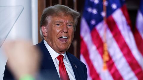 Donald Trump cheers on his audience at an event held after his new impeachment