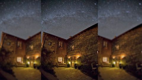 La casa rural Eido das Estrelas con la Vía Láctea brillando sobre ella